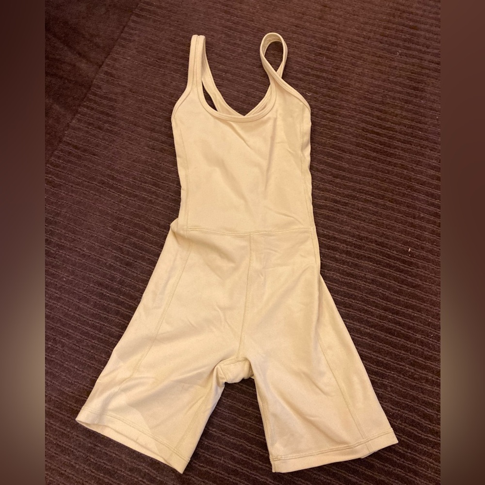 Aritzia TNAction Golden Yellow cross back activewear jumpsuit